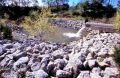 A riprap-lined plunge basin.